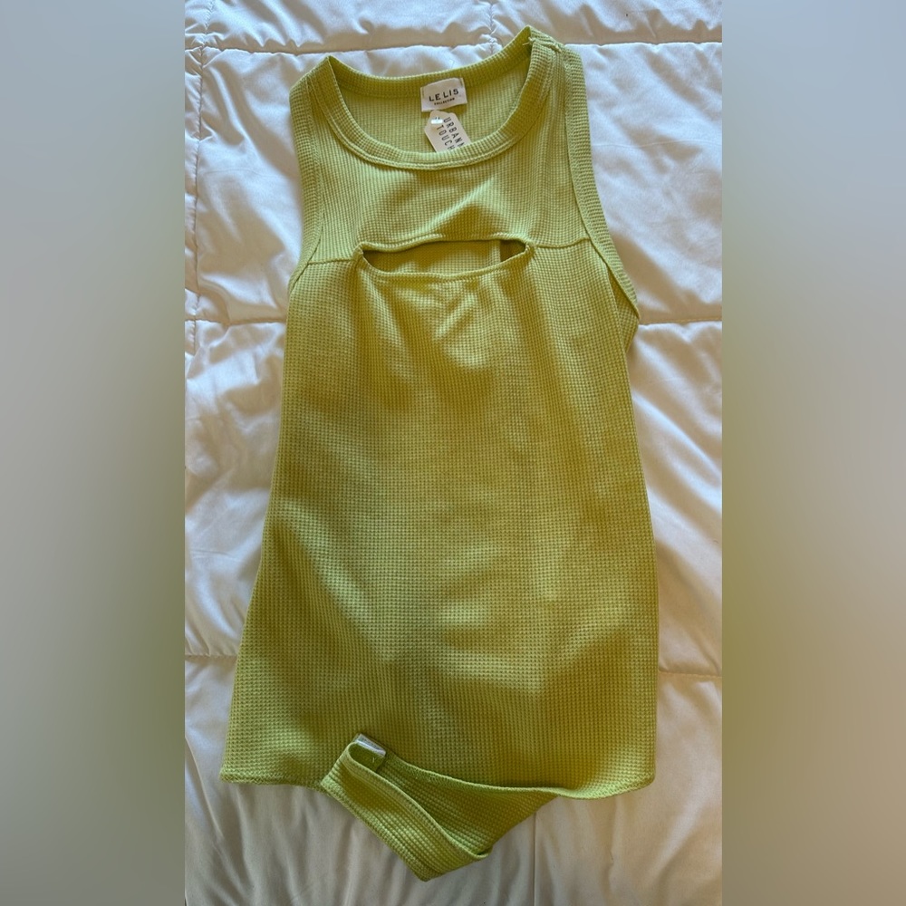 Waffle material sleeveless thong body suit with cut out on upper chest
